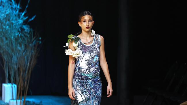 A model showcases the Green Love collection from designer Bernard Singleton at the Cairns Indigenous Art Fair fashion performance, Woven, held at the Tanks Arts Centre, Edge Hill. Picture: Brendan Radke