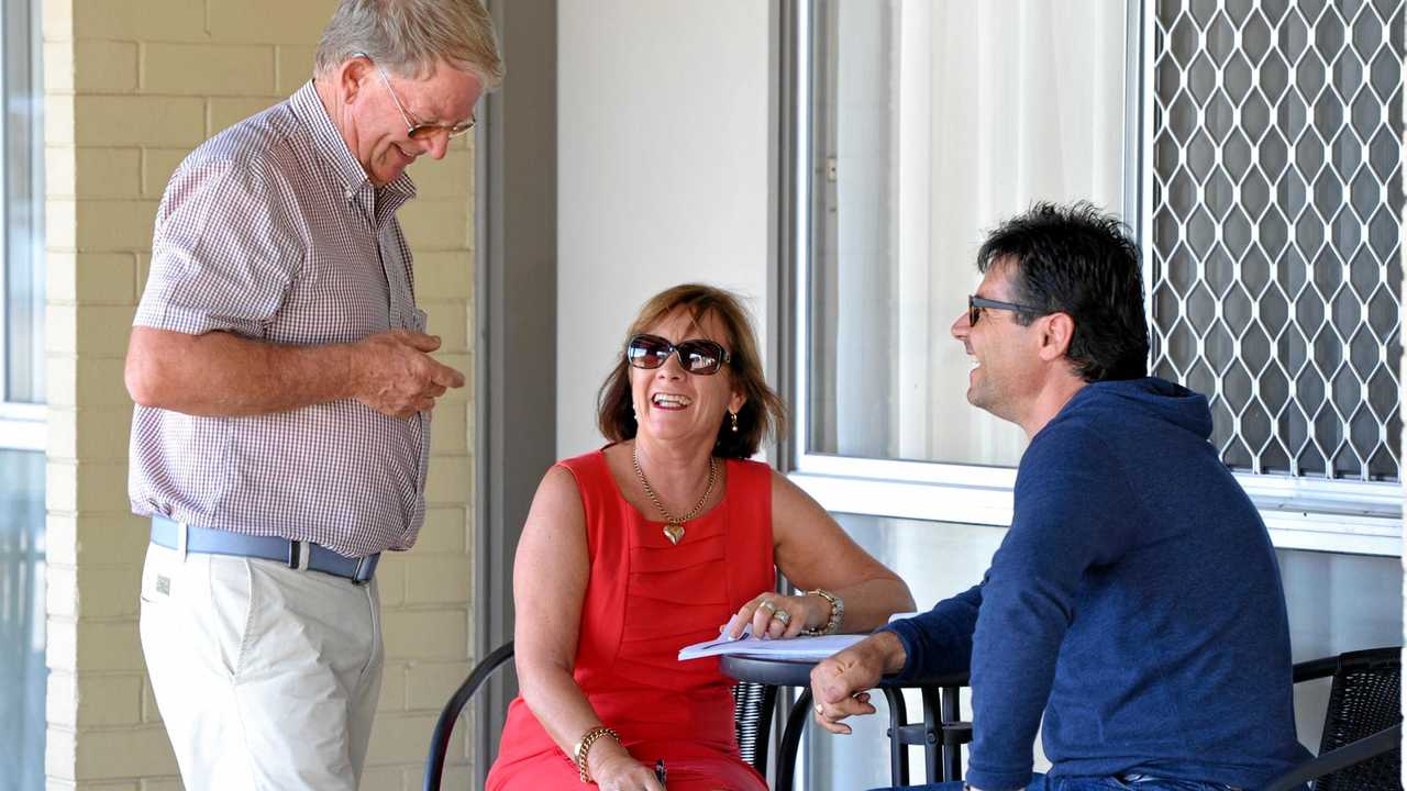 Auctioneer John Warren and Debbie Nicholson from Tourism Brokers with the new owner of the Gladstone Motel Tasos Barounis. Picture: Mike Richards GLA050517MOTEL