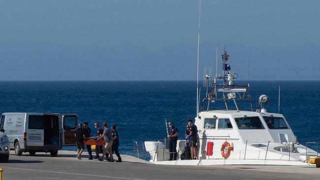 The Greek coast guard disembarks Michael Mosley’s body at the port of Rhodes. Picture: AFP.