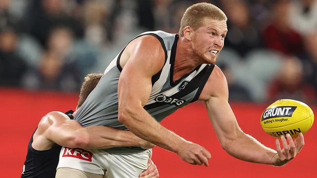 Port’s Tom Clurey clears a handball. Picture: Michael Klein