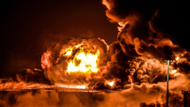 Smoke and flames rise from a Saudi Aramco oil facility in Saudi Arabia's Red Sea coastal city of Jeddah, on March 25, 2022, following a reported Yemeni rebels attack.