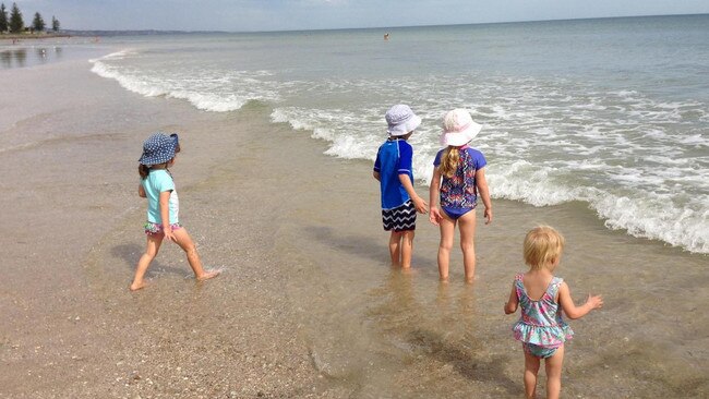 Rosie, Ali, Drew and Ellie splashing at the beach.