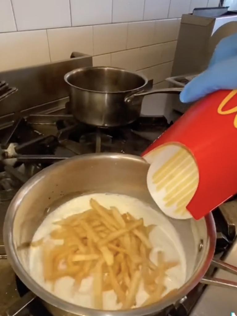 The chef added the fries to milk, cream, bay leaves and garlic. Picture: TikTok/@danny.kim.