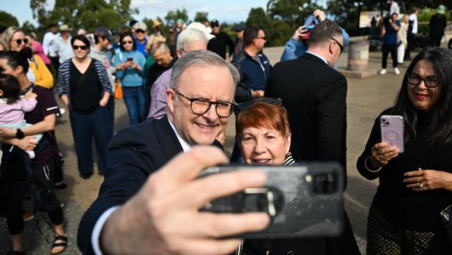 The Prime Minister, Anthony Albanese takes a selfie with a supporter at Mount Coot-Tha lookout in Brisbane. Picture: Dan Peled