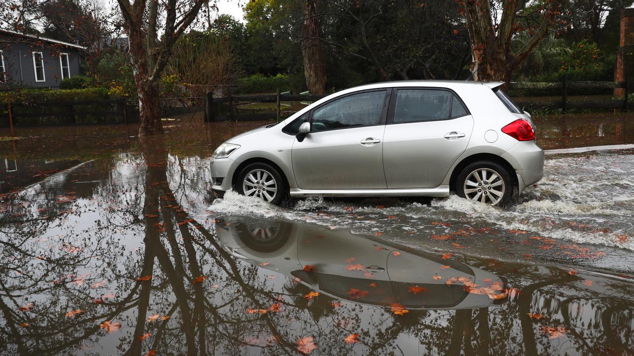 A local drives on Arndell St, Windsor on Monday morning. Picture: John Grainger