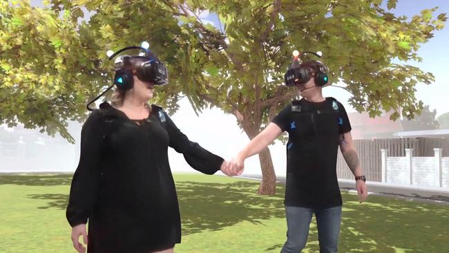 The virtual reality tree, with Alex and Kelly checking it out. Picture: Supplied