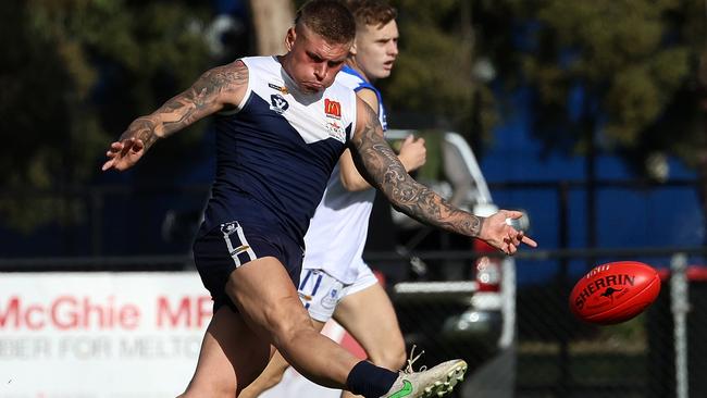 Ballarat: Mitch Caddy gets a kick for Melton South. Picture: Hamish Blair