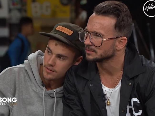 Video still of singer Justin Bieber leaning on pastor Carl Lentz during an interview at the annual Sydney Hillsong Church Convention. Picture: YouTube