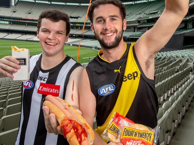 Footy fans, Tim Hill and Luke Draffen with their favourite tucker at the MCG.Picture: Jay Town