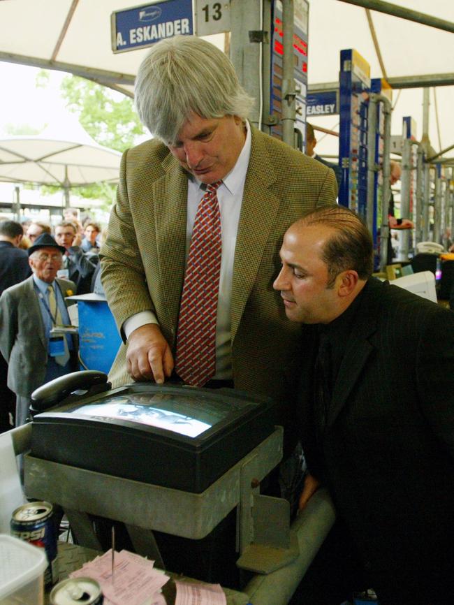 Tony Mokbel with rails bookmaker Frank Hudson at Flemington racecourse on Oaks Day in 2004