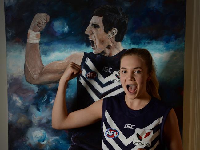 Ebony Fisher, 18, can't remember a time when Matthew Pavlich wasn't playing. She painted a massive painting that hangs in her family's home.