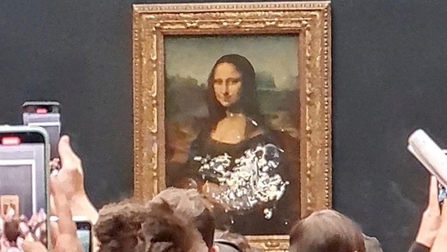 The Mona Lisa in the Louvre, Paris, after being smeared in cake. Picture: Twitter