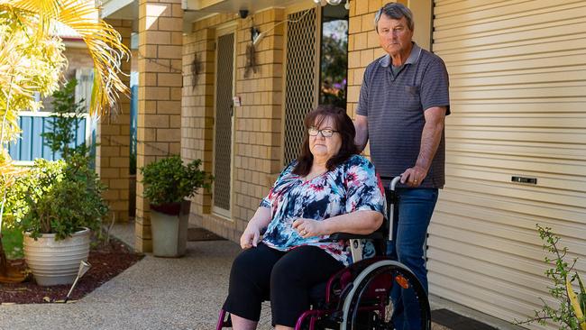 Jennifer Arnold relies on a wheelchair and care from her husband Mark Jenkins after spinal surgery she claims went wrong in 2018.