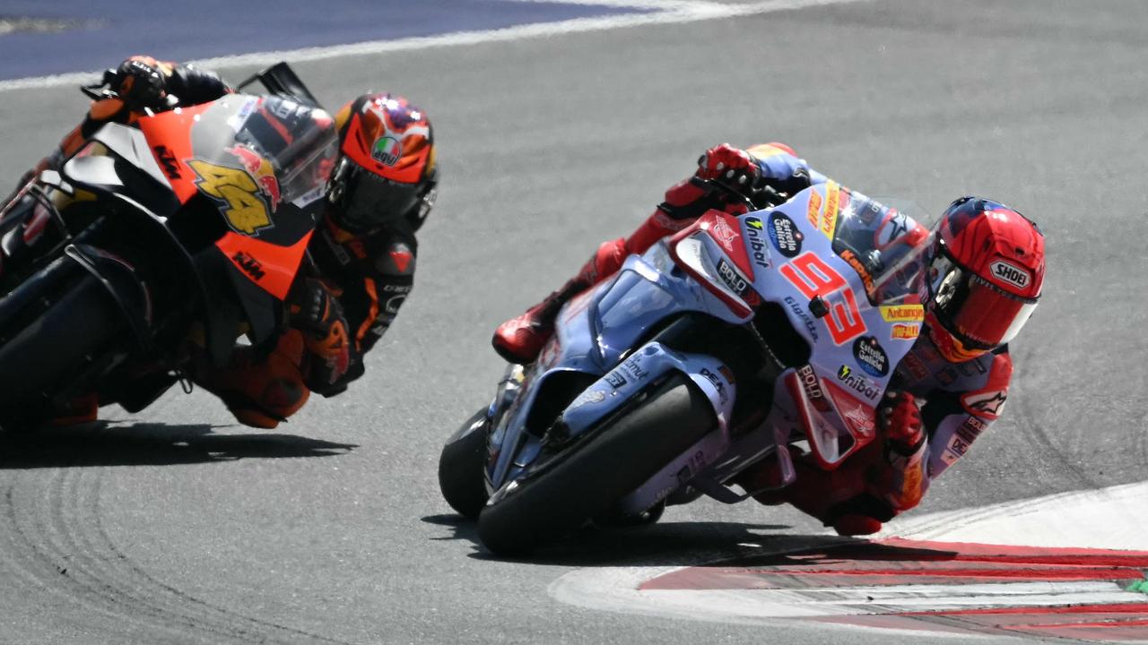 Gresini Racing MotoGP's Spanish rider Marc Marquez (R) overtakes Red Bull KTM Factory Racing's Spanish rider Pol Espargaro during the Austrian MotoGP race at the Red Bull Ring in Spielberg, Austria on August 18, 2024. (Photo by Jure Makovec / AFP)