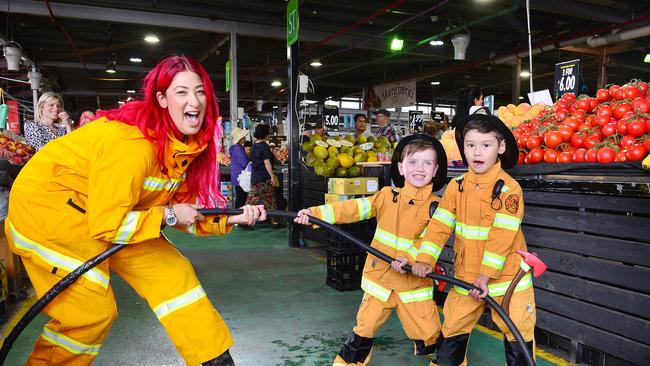 Volunteer firefighter Nada El-Masri and 5 year olds Flynn and Ollie gearing up for the Dandenong Night Market entertainment with a tug of war. Picture: Nicki Connolly