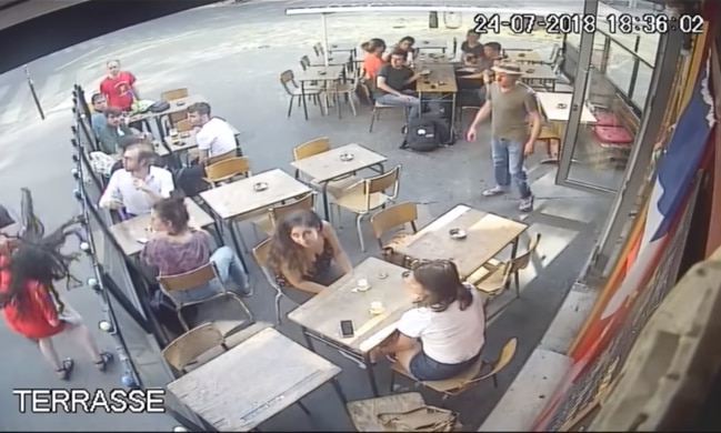 Marie Laguerre (left) is punched in Paris.