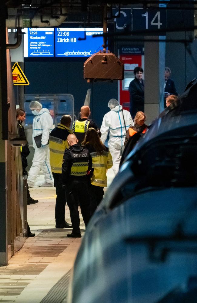 Police and forensic officers on the railway platform at Hamburg’s main train station after the knife attack. Picture: Jonas Walzberg / AFP