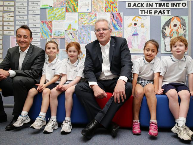 Prime Minister Scott Morrison and Dave Sharma, Candidate for Wentworth with year 1 students from left Ben Mayne, 7, Grace Logan, 7, Tayla Beazley, 7 and Cormac Maher, 7, during a visit to Galilee Catholic Primary School in North Bondi. Picture: Jonathan Ng