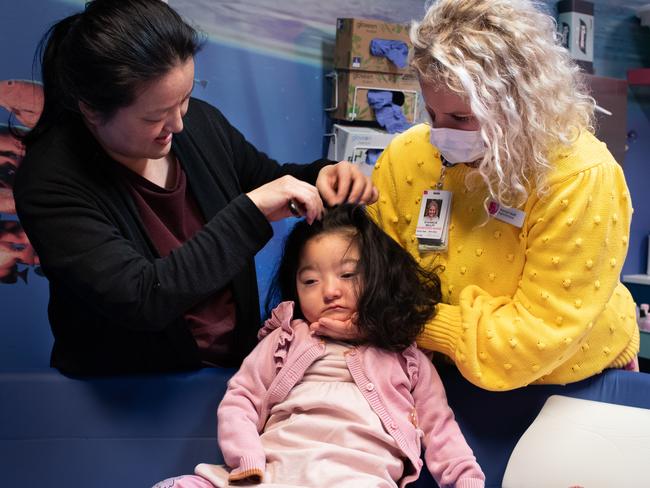 Sara and registered nurse Shannon Wulff get Jessica ready in the morning by combing her hair. Picture: Julian Andrews