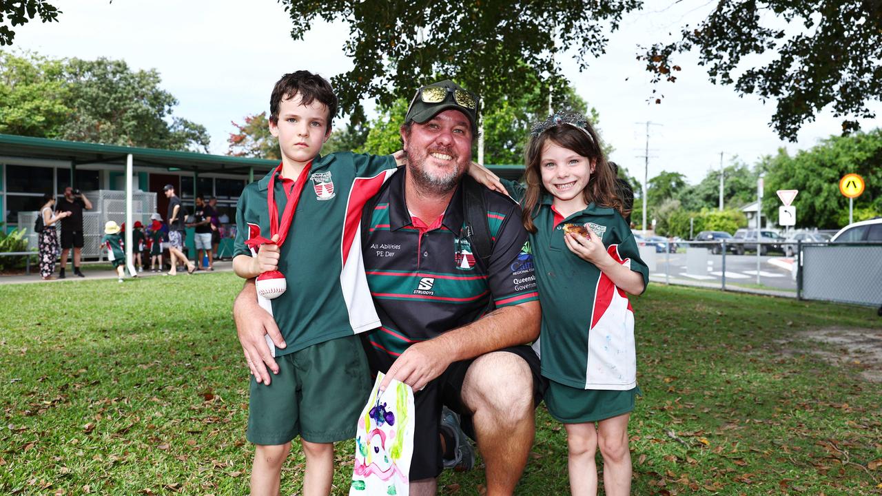 Michael Arcidiacono with his twins Hudson Arcidiacono and Isla Arcidiacono, both 6, at the Whitfield State School Father's Day activity afternoon. Picture: Brendan Radke