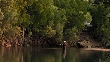 A bloke has been snapped wading into Rapid Creek over the weekend for a fish. Picture: Supplied