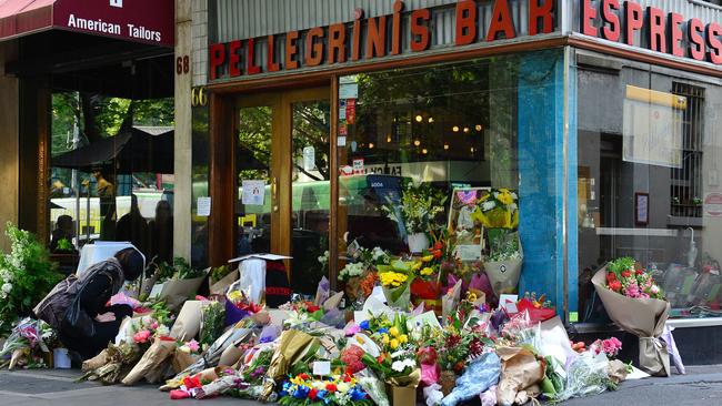 Flowers are laid in tribute to Sisto Malaspina outside Pellegrini’s. Picture: Nicki Connolly