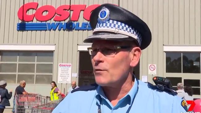 A police officer presence outside the Costco store in Casula Picture: 7News