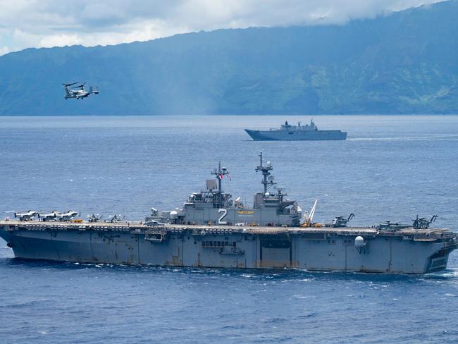 PACIFIC OCEAN (July 29, 2022) The Wasp-class amphibious assault ship USS Essex (LHD 2), front, and the Royal Australian Navy Canberra-class landing helicopter dock HMAS Canberra (L02) transit the Pacific Ocean during Rim of the Pacific (RIMPAC) 2022 during an amphibious raid. Twenty-six nations, 38 ships, three submarines, more than 170 aircraft and 25,000 personnel are participating in RIMPAC from June 29 to Aug. 4 in and around the Hawaiian Islands and Southern California. The world's largest international maritime exercise, RIMPAC provides a unique training opportunity while fostering and sustaining cooperative relationships among participants critical to ensuring the safety of sea lanes and security on the world's oceans. RIMPAC 2022 is the 28th exercise in the series that began in 1971. (U.S. Navy photo by Mass Communication Specialist 2nd Class Wesley Richardson) PHOTO - U.S. NAVY