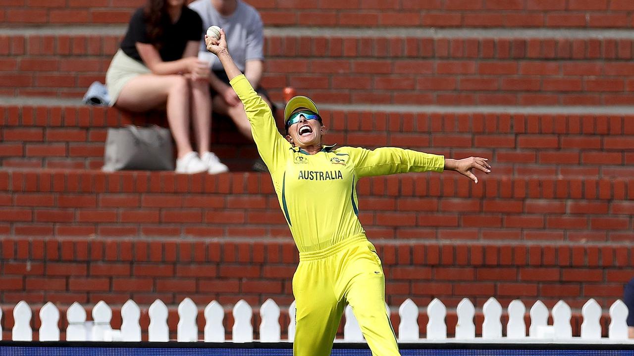 Australia's Ashleigh Gardner takes a successful catch to dismiss South Africa's Mignon du Preez during the Women's Cricket World Cup match between Australia and South Africa at the Basin Reserve in Wellington on March 22, 2022. (Photo by Marty MELVILLE / AFP)