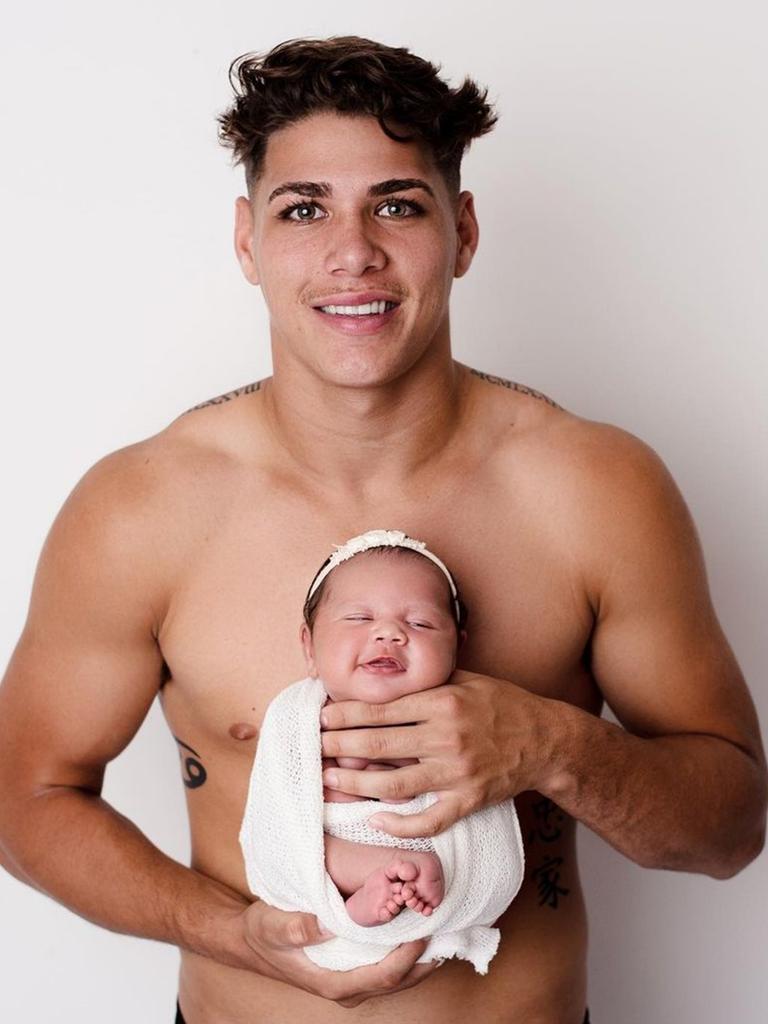 Reece Walsh and his baby daughter.