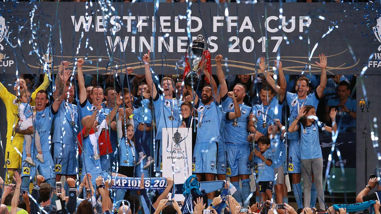 Sydney players celebrate winning the FFA Cup.