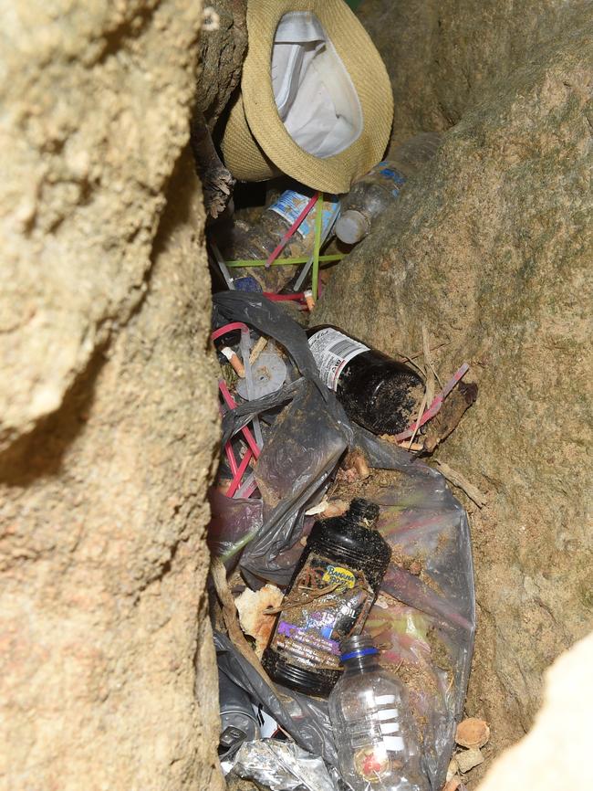 More rubbish rests out of reach down a hole in the cliffs.