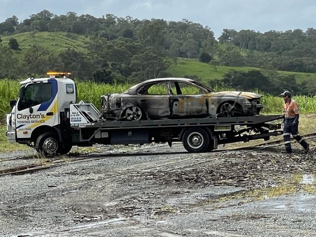 Police and Fireys responded to reports of a burnt out vehicle over a cane train line near Habana. Photo: Fergus Gregg