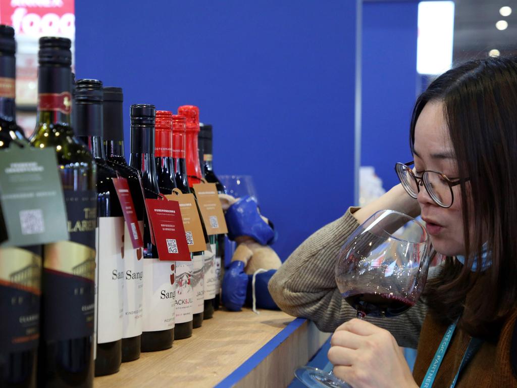 A woman tasting red wine from Australia at the Food and Agricultural Products exhibition at the third China International Import Expo (CIIE) in Shanghai last month.