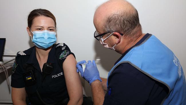 South Australia Police Officer, Amanda Kuchel receives her first injection of COVID-19 Vaccine, administered by Nurse Craig Robinson at the COVID-19 Clinic at The Royal Adelaide Hospital. Picture: NCA NewsWire / Emma Brasier