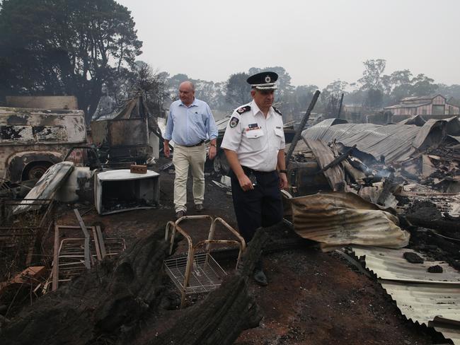 Former Emergency Services Minister David Elliott and then-Deputy RFS Commissioner Rob Rogers tour the devastation caused by bush fires in the small town of Wingella just outside of Bundanoon during th2020 bushfires. Picture: David Swift.