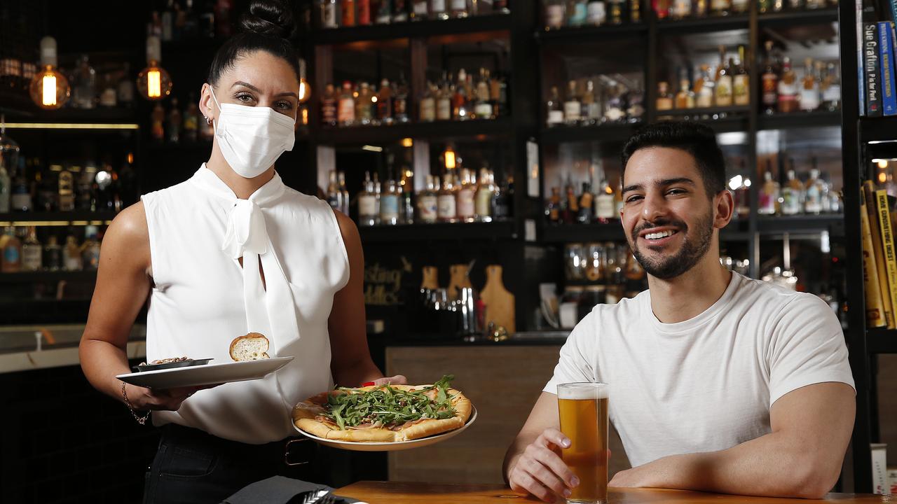 Belinda Winch with Mousa Saket at Eleven Bridges gin bar in South Brisbane, which uses the buy now, pay later app Payo. Picture: Josh Woning