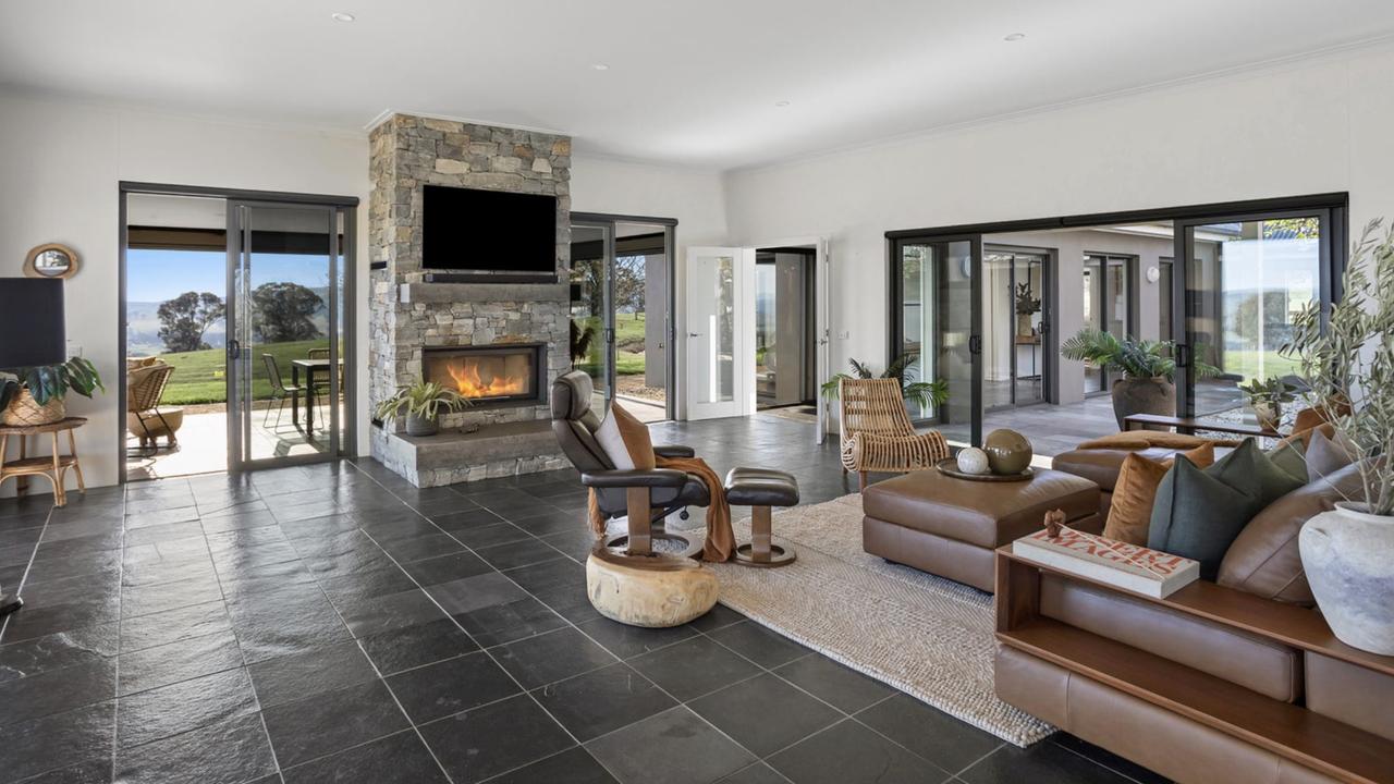 An open-plan living area with a fireplace .