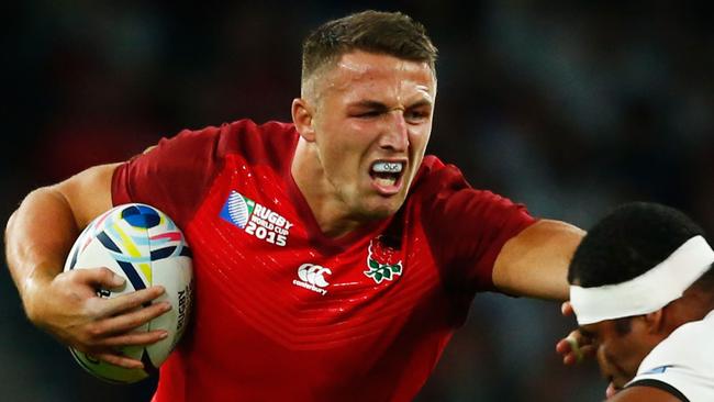 LONDON, ENGLAND - SEPTEMBER 18: Sam Burgess of England hands off Tuapati Talemaitoga of Fiji during the 2015 Rugby World Cup Pool A match between England and Fiji at Twickenham Stadium on September 18, 2015 in London, United Kingdom. (Photo by Shaun Botterill/Getty Images)