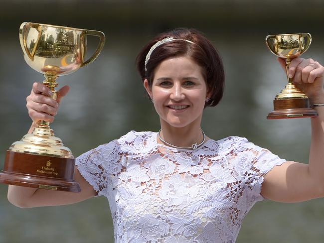 Michelle Payne with her Melbourne Cup. Picture: AFP Photo/Mal Fairclough