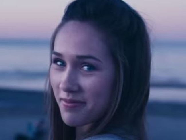 Bonfire babe ... the ad highlights extra-curricular activities rather than book-learning.