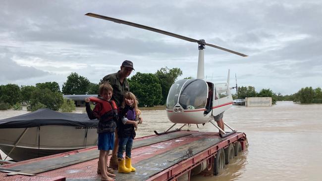 The Wilson family were evacuated from Tirranna Roadhouse to nearby property above the floods and they were able to take their mini-dachshund Mac with them.