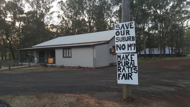 Placards against the Outer Sydney Orbital and 30 per cent rate rise.