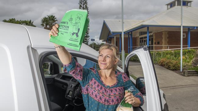 Chrissy Hancock with a familiar and popular sight around Grafton: A Hank’s Kitchen green paper bag. Photo: Adam Hourigan