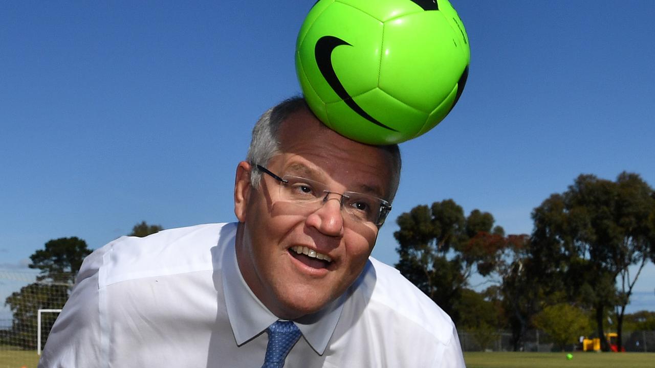 Scott Morrison tries soccer. Picture: AAP Image/Mick Tsikas