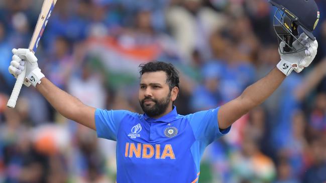 TOPSHOT - India's Rohit Sharma celebrates after reaching his century during the 2019 Cricket World Cup group stage match between Sri Lanka and India at Headingley in Leeds, northern England, on July 6, 2019. (Photo by Dibyangshu Sarkar / AFP) / RESTRICTED TO EDITORIAL USE