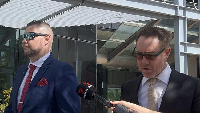 Ex-police officer Rowan Leslie Larkin (left) leaving the Southport courthouse with lawyer Dan Rawlings. Picture: Jessica Paul