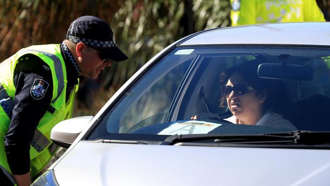 Police speak to drivers at the Qld-NSW border at Coolangatta. Picture: Adam Head