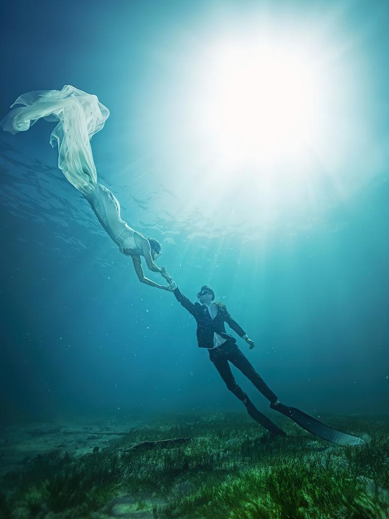 Jack and Jessica Alderman at Port Noarlunga for their "wreck the dress" shoot. Picture: SvenStudios