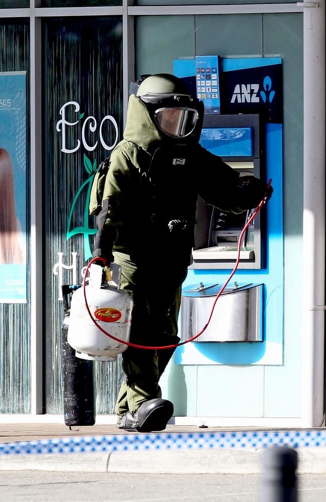 Bomb sqaud member Jodie Pearson attends to an ANZ ATM that has hoses and gas bottles attached to it at The Anchorage Village Shopping Centre on Belgravia Terrace in Rockingham. Picture: Lincoln Baker/The West Australian.